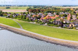 Wohnung kaufen in 25541 Brunsbüttel, Reetdach-Refugium mit Elbblick und perfekter Südausrichtung