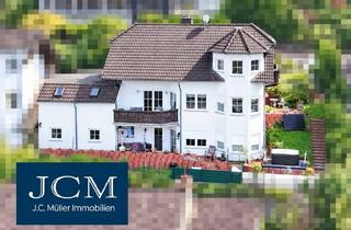 Einfamilienhaus kaufen in 56581 Ehlscheid, Gepflegtes Einfamilienhaus mit Einliegerwohnung, Garten und Garagen in ruhiger Lage von Ehlscheid