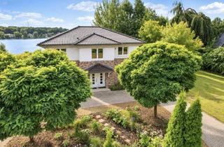 Einfamilienhaus kaufen in 27607 Langen, Einzigartige Wasserlage – Hochwertiges Einfamilienhaus mit privatem Seezugang und Einliegerwohnung