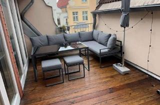 Wohnung kaufen in 23966 Altstadt, Dachgeschosswohnung mit großzügiger Holzterrasse und lichtdurchflutetem Wohnbereich