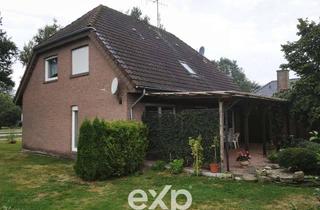 Haus kaufen in 26903 Surwold, Zweifamilienhaus mit zwei separaten Einheiten, Garage und großem Grundstück in Surwold