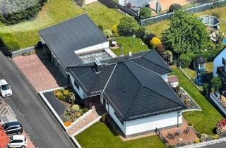 Haus kaufen in Rosenweg 11, 35410 Hungen, Traum-Bungalow mit Wintergarten, Specksteinofen, neue Heizung, Doppelgarage - provisionsfrei