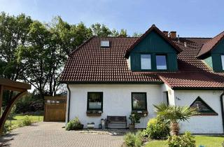 Doppelhaushälfte kaufen in 27412 Wilstedt, Tolles Renditeobjekt: Stilvolle Doppelhaushälfte mit unverbaubarem Ausblick – in traumhafter Lage be