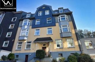 Wohnung kaufen in 42277 Wuppertal, Charmante 2-Zimmer-Altbauwohnung mit großer Wohnküche, Balkon & Gartenblick
