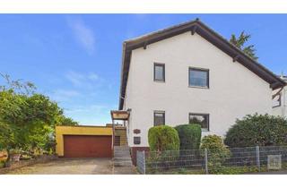 Haus kaufen in 55278 Mommenheim, Platz für zwei Generationen: Ein- bis Zweifamilienhaus mit Doppelgarage & Garten in Mommenheim