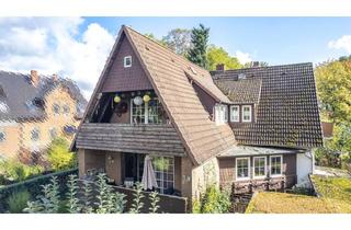 Haus kaufen in 31737 Rinteln, Zweifamilienhaus in gefragter Wohnlage von Rinteln mit Wintergarten, drei Balkonen und Doppelgarage