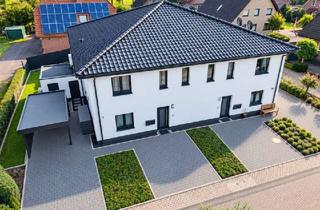 Wohnung kaufen in 33449 Langenberg, Modernes Wohnen mit eigenem Garten – hochwertige 3-Zimmer-Erdgeschosswohnung