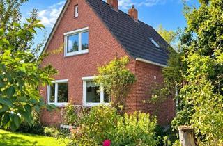 Einfamilienhaus kaufen in 26759 Hinte, Mit Mühlenblick: Gemütliches Einfamilienhaus mit Garage und hübschem Garten in ruhiger Wohnlage