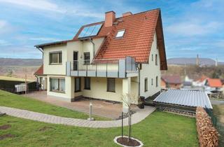 Haus kaufen in 36414 Unterbreizbach, Großzügiges Zweifamilienhaus in idyllischer Feldrandlage – vielseitige Wohnmöglichkeiten auf 1.768 m