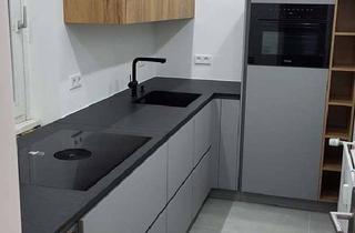 Wohnung kaufen in 40699 Erkrath, Modernisierte 2-Zimmer-Wohnung mit saniertem Balkon, Miele-Küche und Stellplatz in Erkrath-Hochdahl