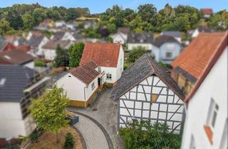 Einfamilienhaus kaufen in 35444 Biebertal, Charmantes Einfamilienhaus mit Anbau, Keller und großzügiger Scheune in Biebertal-Frankenbach!