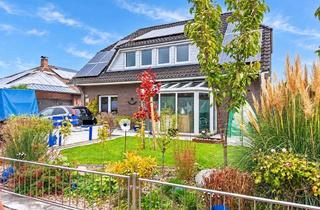 Haus kaufen in 26969 Butjadingen, Ein Zuhause für viele Lebensentwürfe - Zweifamilienhaus mit PV-Anlage in Nordseenähe!