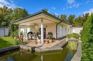 Haus kaufen in 16321 Bernau, Moderner Bungalow mit großzügigem Wohnbereich und liebevoll angelegtem Garten in Bernau (Schönow)