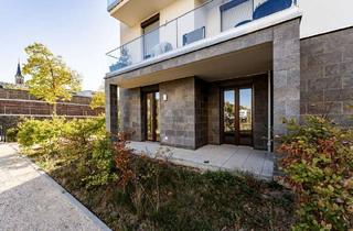 Wohnung kaufen in 55411 Bingen, Stylisch, zentral und direkt am Fluss: Hochwertige 2-Zimmer-Wohnung mit Gartenanteil am Rhein