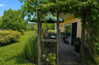 Haus kaufen in 61279 Grävenwiesbach, Familienleben im Grünen auf sonnigem Grundstück – Bungalow mit schönem Garten, Fernsicht und Garage