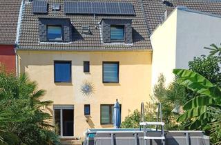 Reihenhaus kaufen in 46149 Schwarze Heide, Charmantes Zweifamilien-Reihenhaus mit mediterranem Garten in ruhiger Lage von Schwarze-Heide!