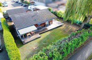 Haus kaufen in 63110 Rodgau, Naturnahes Holzhaus mit Doppelgarage, Carport und großem Garten auf ca. 923 m² – Wohnen & Arbeiten i