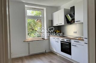 Wohnung kaufen in 23560 Lübeck, Attraktive Kapitalanlage in Lübeck: Vermietete 2-Zimmer-EG-Wohnung mit Balkon & eigenem Garten