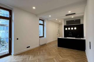 Wohnung kaufen in 40219 Unterbilk, Kernsanierte EG-Altbauwohnung mit hohen Decken und Sonnenterrasse
