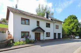 Haus kaufen in 36148 Kalbach, Vermietetes Wohnhaus mit 2 Wohneinheiten und großen Garagen in Oberkalbach
