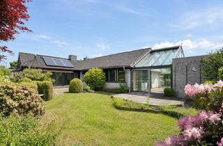 Haus kaufen in 31535 Neustadt, Komfortables Wohnen auf einer Ebene im stilvollen Winkelbungalow mit liebevoll gestaltetem Garten in