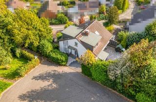 Haus kaufen in 51399 Burscheid, Burscheid: Freistehendes Zweifamilienhaus mit vielseitigen Nutzungsmöglichkeiten in Sackgassenlage!