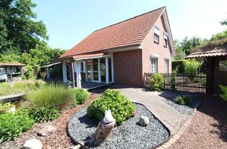 Einfamilienhaus kaufen in 21762 Otterndorf, Exquisites Einfamilienhaus mit idyllischer Gartenanlage + Teich, Saunahaus, Carport & neue Heizung