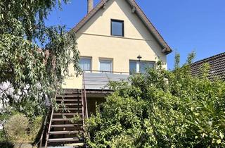 Haus kaufen in 74746 Höpfingen, Zweifamilienhaus mit großem Grundstück und vielseitigen Nutzungsmöglichkeiten in Höpfingen